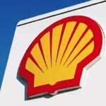 Shell logo with cybersecurity breach warning alert on screen
