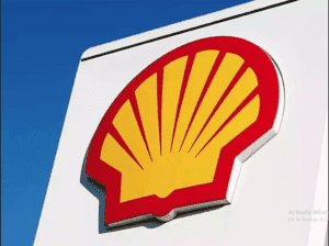 Shell logo with cybersecurity breach warning alert on screen